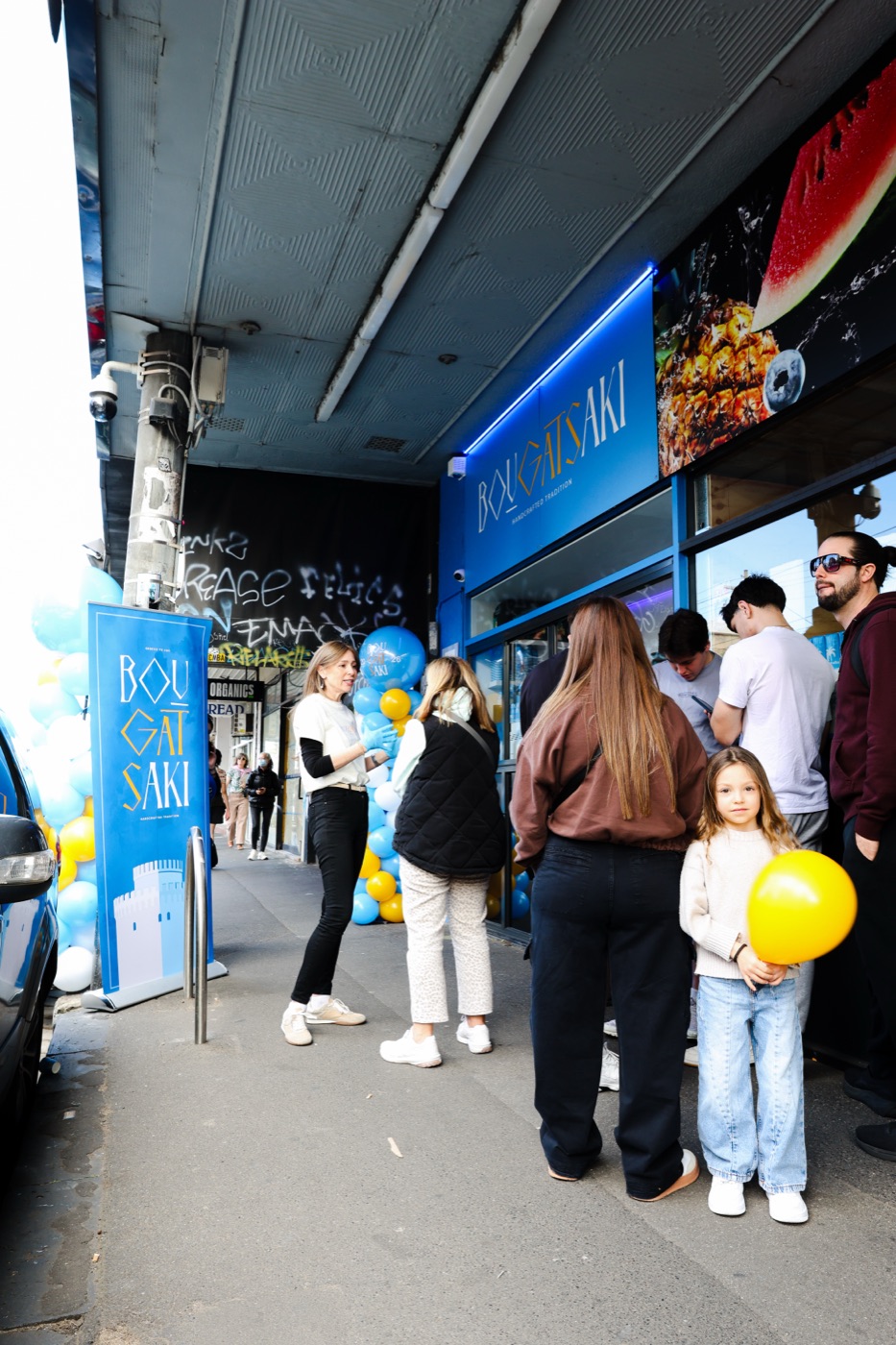 Customers queuing outside the Bougatsaki flagship store on Sydney Road, Brunswick, on opening day